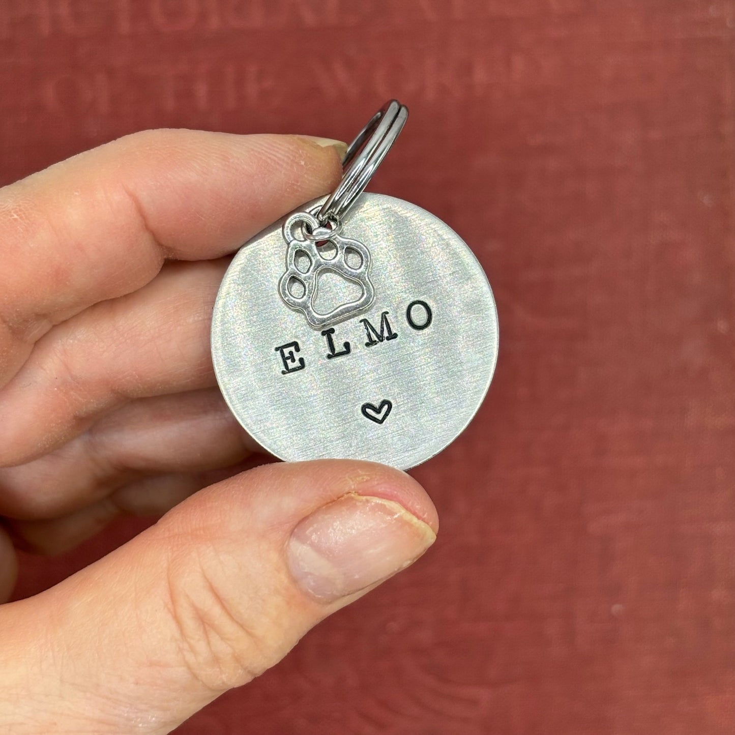 Dog tag, double-sided, hand-stamped with a silver dog paw charm