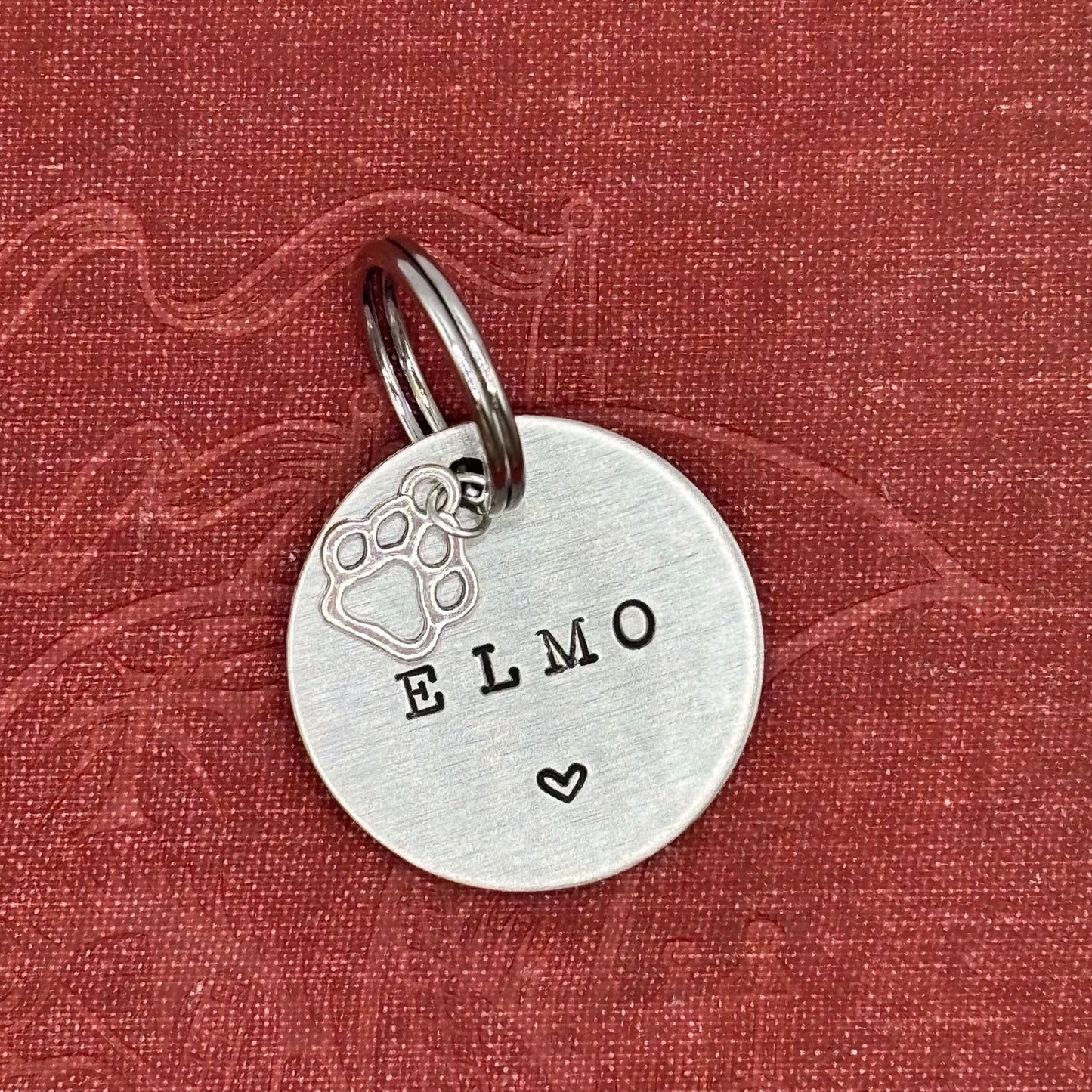 Dog tag, double-sided, hand-stamped with a silver dog paw charm 
