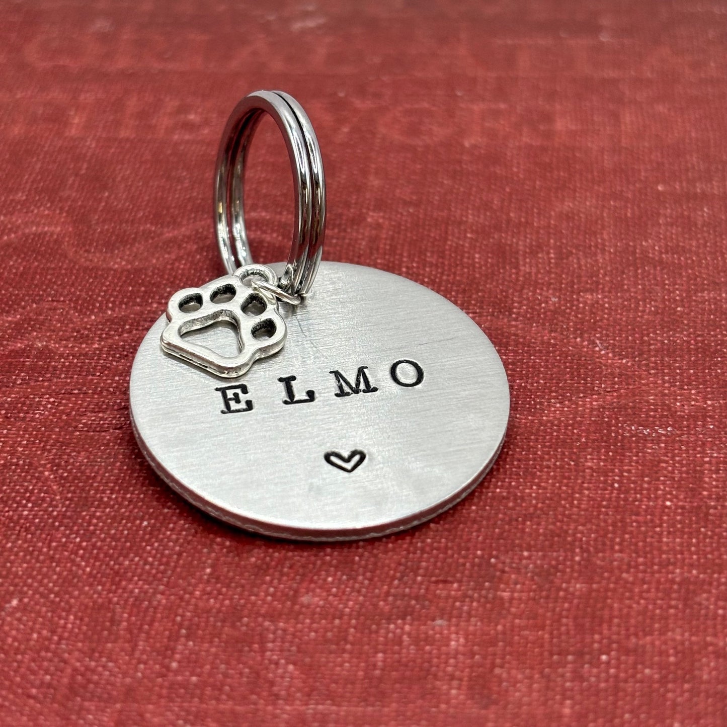 Dog tag, double-sided, hand-stamped with a silver dog paw charm 